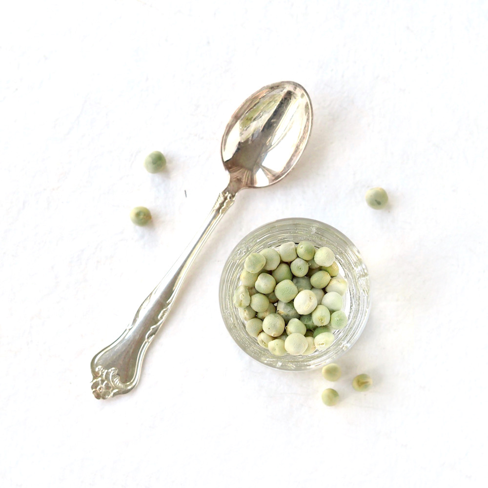 organic peas for sprouts soaking in water