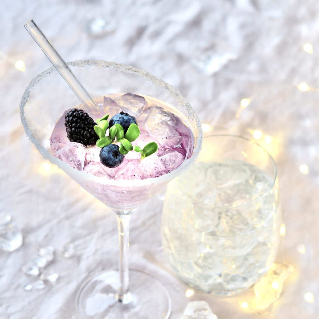 Cocktail with fresh sprouts and berries